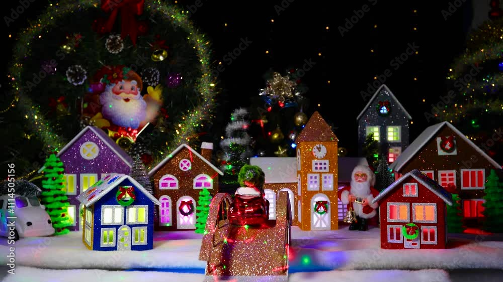 Beautiful Christmas brown bridge with a red car with a Christmas tree on the roof against the background of a Christmas town Beautiful Christmas brown bridge with a red car with a Christmas tree on the roof against the background of a Christmas town