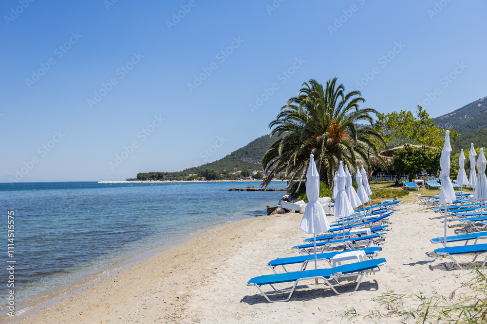 Fototapeta premium Picturesque sandy beach in Greece perfect summer vacation destination for relaxation by the sea.