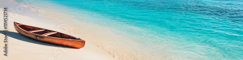 Wooden canoe resting on sandy beach by turquoise water