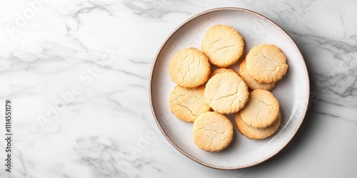 Buttery shortbread cookies on a ceramic plate, marble background, space for text, top view. photo