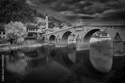 Historic bridge with arches in the old town Konjic, Bosnia and Herzegovina photo