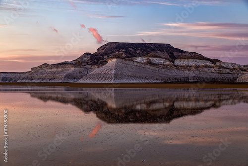 Kazakhstan, Mangistau, Mangyshlak, Tuzbair. Geological chalk formations. The process of destruction of the ancient Tethys Ocean. . Salt lake with a thin layer. Reflection of the sunset