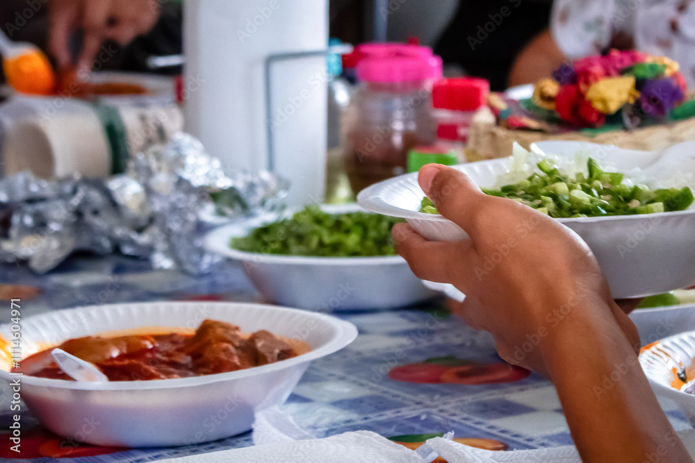 Family reunion enjoying a traditional mexican dish called pork backbone broth, better called Family reunion enjoying a traditional mexican dish called pork backbone broth, better called