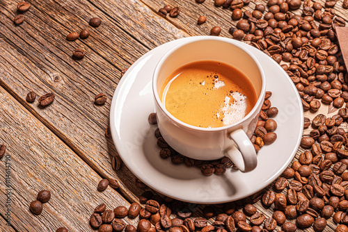 A cup of aromatic coffee on a wooden table.