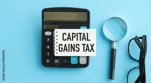 Capital gains tax-text label in the form of a document Registrar planning folder. Mandatory gratuitous payment is established by law by the state government. photo