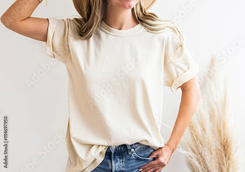 Girl wearing blank soft cream, ivory t shirt mock up , for home boho designs. Cream colors t shirt for your design