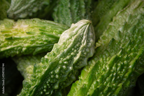 Momordica charantia or bitter melon, cerassee, goya,  cucumber on the market. Tropical and subtropical vine of the family Cucurbitaceae