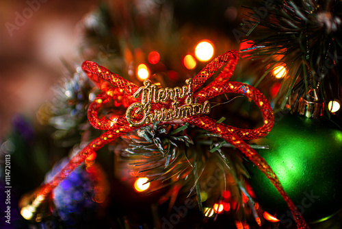 Beautiful festive decorations on the Christmas tree. New Year 2025