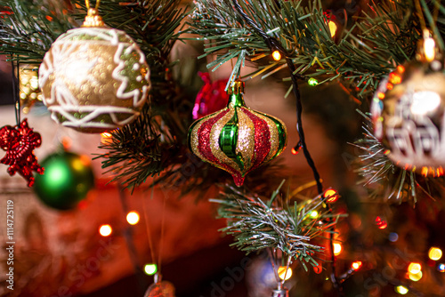 Beautiful festive decorations on the Christmas tree. New Year 2025