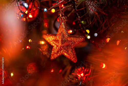 Beautiful festive decorations on the Christmas tree. New Year 2025