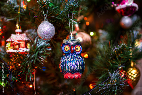 Beautiful festive decorations on the Christmas tree. New Year 2025