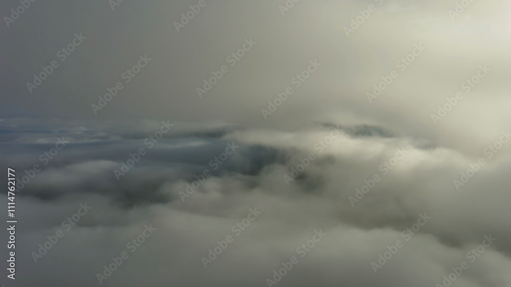 Aerial view of clouds and mountains at sunrise Aerial view of clouds and mountains at sunrise