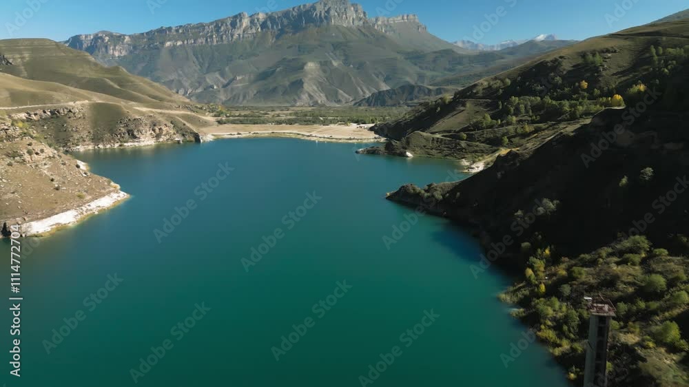 Mountain lake with blue water in a picturesque gorge. Landscape and nature of the North Caucasus Mountain lake with blue water in a picturesque gorge. Landscape and nature of the North Caucasus