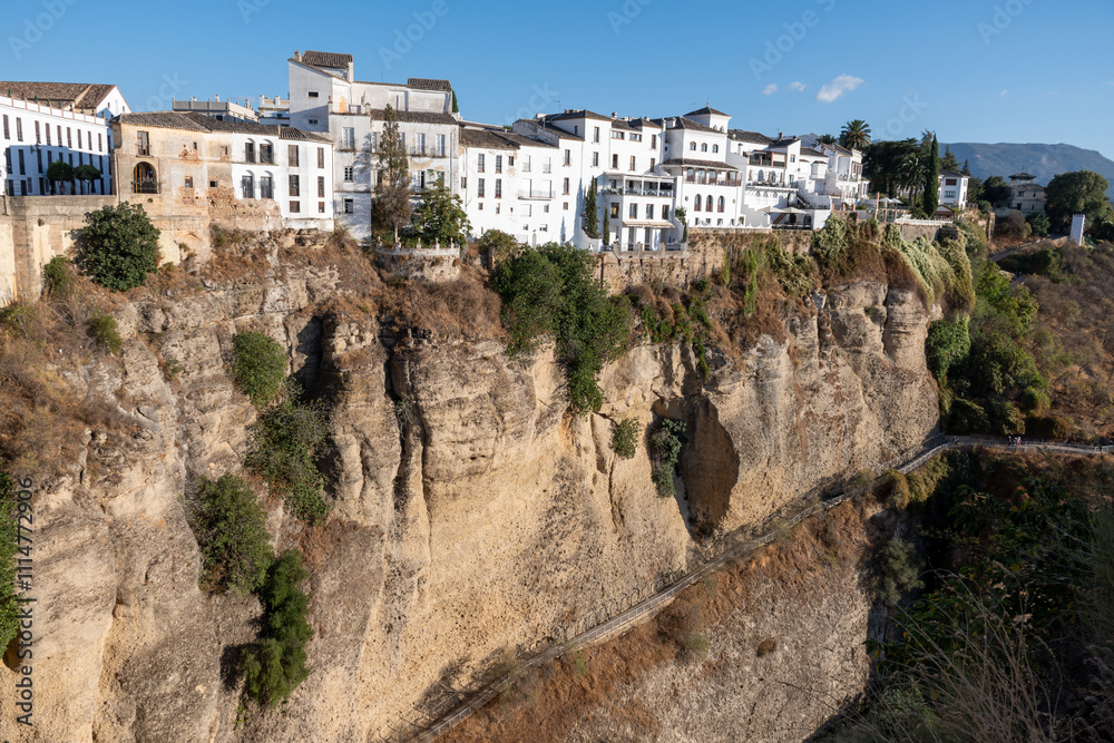 View on Ronda and ravine from Puente Nuevo new bridge, touristic town in Andalusia, Pueblo Blanco white village, Spain. View on Ronda and ravine from Puente Nuevo new bridge, touristic town in Andalusia, Pueblo Blanco white village, Spain.