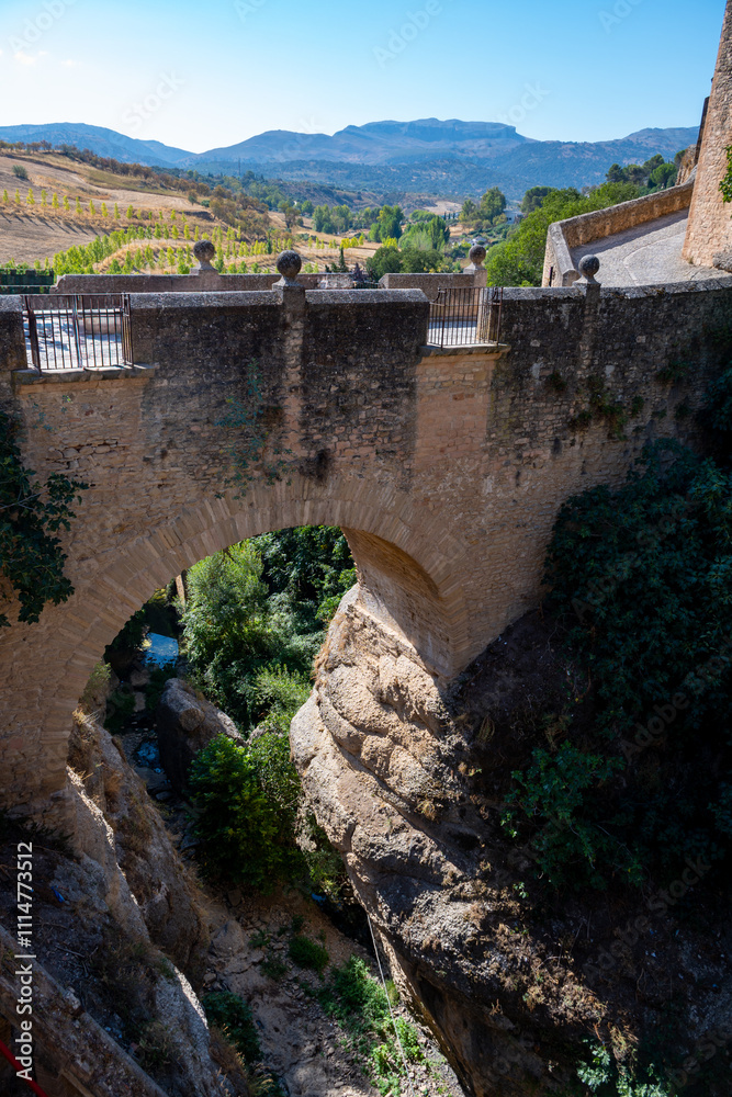 Walking in Ronda, touristic town in Andalusia, Pueblo Blanco white village, Spain. Historical buildings.