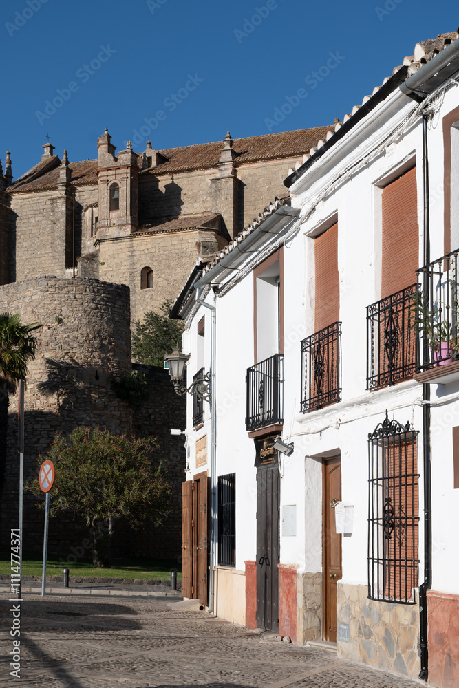 Fototapeta premium Walking in Ronda, touristic town in Andalusia, Pueblo Blanco white village, Spain. Historical buildings.