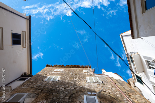 Fototapeta Naklejka Na Ścianę i Meble -  White old houses and narrow streets in medieval small touristic coastal town Sperlonga, Latina, vacation in Italy