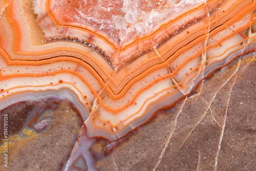 Natural layers and patterns in vibrant orange and brown stone photo