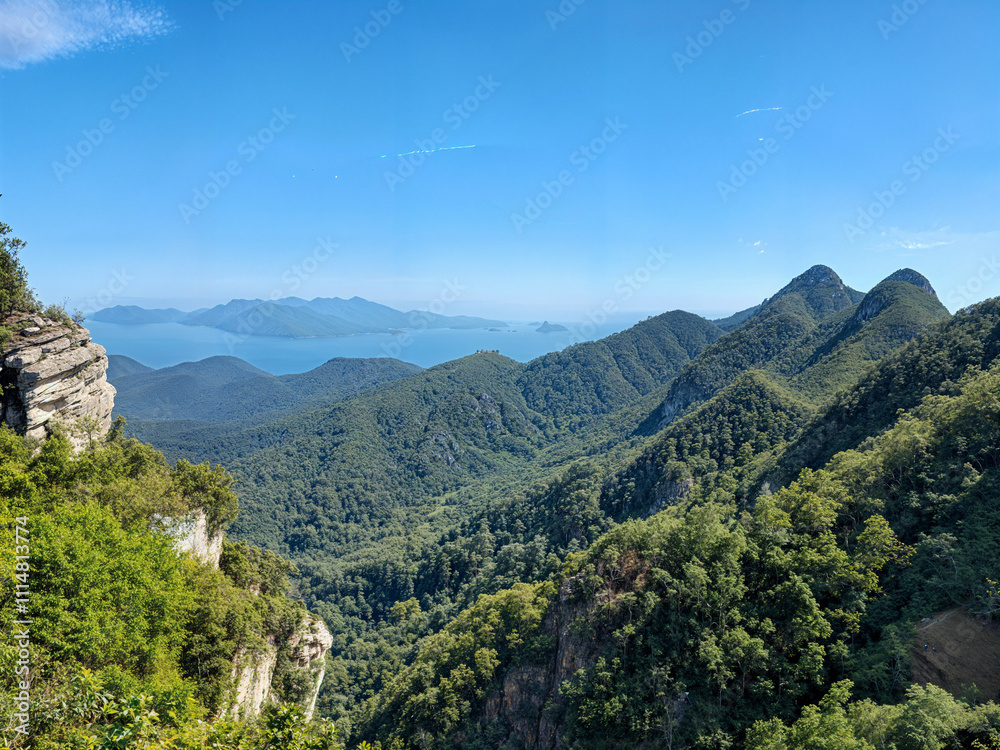 Fototapeta premium Planet Pics Collection a Beauty of Natrue, Lens on The World. Mountain and Forest under clear blue sky.