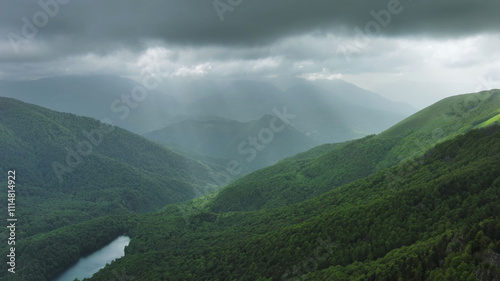 Clouds over summer green mountains photo