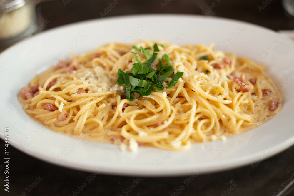 Carbonara pasta, spaghetti with pancetta, egg, hard Parmesan cheese and cream sauce. Traditional Italian cuisine. Pasta alla carbonara. Carbonara pasta, spaghetti with pancetta, egg, hard Parmesan cheese and cream sauce. Traditional Italian cuisine. Pasta alla carbonara.