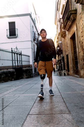 Confident man with prosthetic leg walking in urban setting