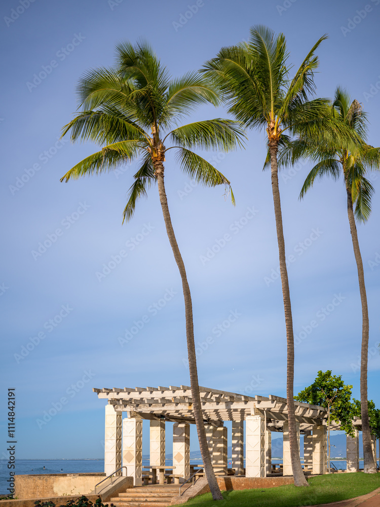 Seascape of Picnic Tables and Benches on a Deserted Stretch of Beach with an Ocean Background. Seascape of Picnic Tables and Benches on a Deserted Stretch of Beach with an Ocean Background.