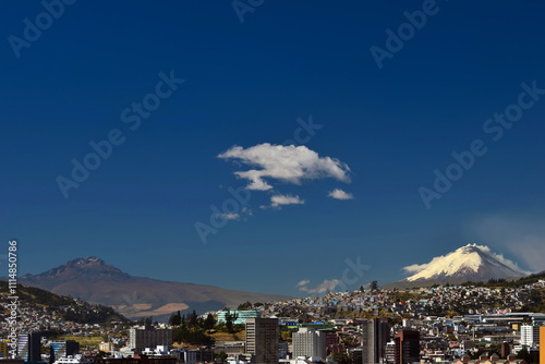 Panoramic view of the city of Quito with two of its volcanoes in the background, Sincholagua and Cotopaxi.