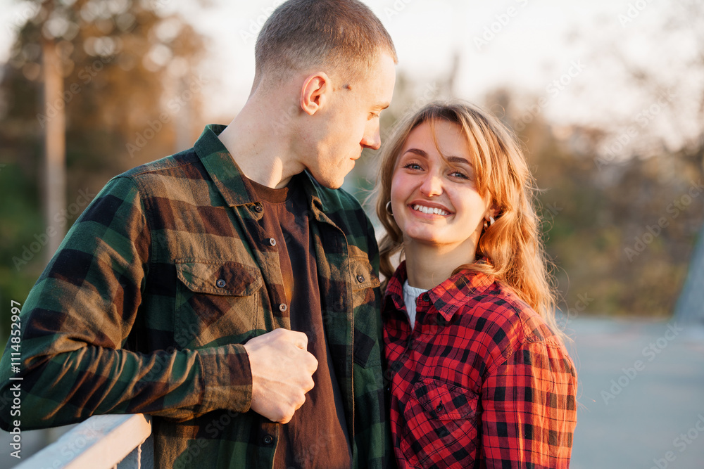 Fototapeta premium Romantic Couple Embracing in Nature During Sunset