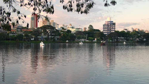 Ipago Lake of Londrina city, Parana, Brazil. A beautiful afternoon at the lake with some pedal boats on the water.