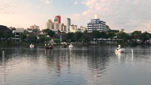Ipago Lake of Londrina city, Parana, Brazil. A beautiful afternoon at the lake with some pedal boats on the water.