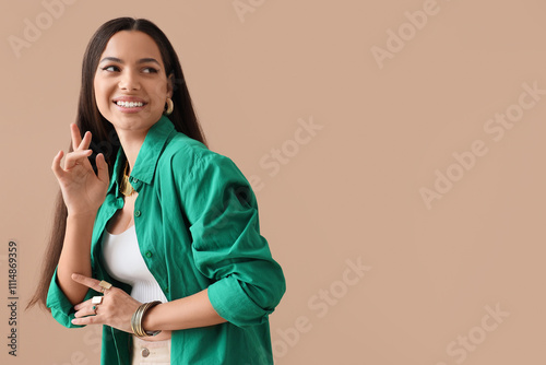 Stylish young woman in beau...