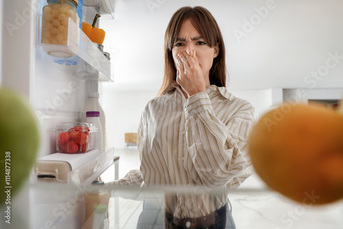 Young woman feeling bad sme...