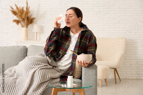 Sick young woman with tissu...