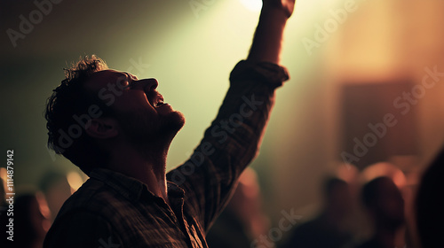 Young Man Worshipping with Emotion and Raised Hand