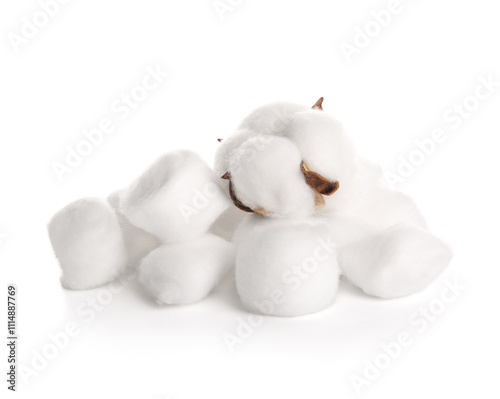 Cotton balls and flower on white background photo