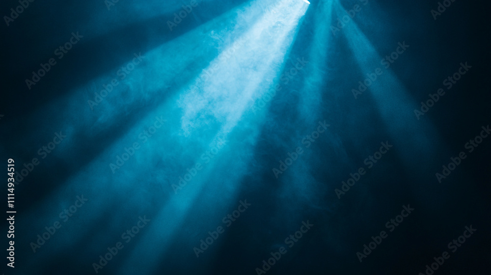 Fototapeta premium Light beams pierce through fog creating a serene atmosphere in a dark space