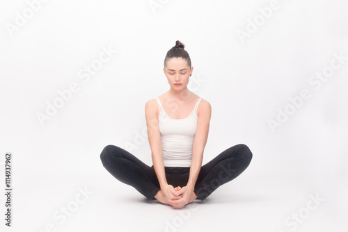 Young woman doing yoga exercise photo