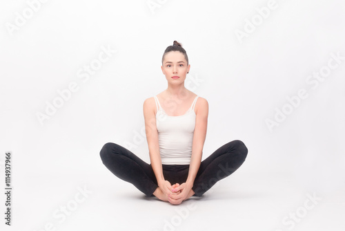 Young woman doing yoga exercise photo