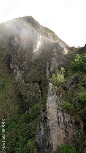 Tropical rocky mountain in colombia with cloud in summer time and sunlight fog