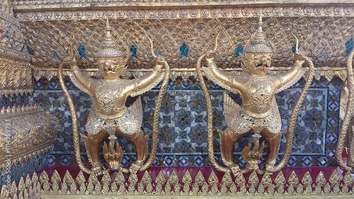 The art of Garuda Grabbing Naga Surrounding the Grand Palace, Bangkok, Thailand