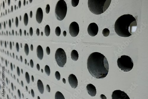 round hole motif on the wall, symmetrical honeycomb motif house fence 