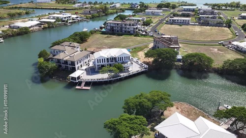 Real Estate Property On The Riverfront Near Wailoaloa In Fiji Islands. Aerial Drone Shot photo