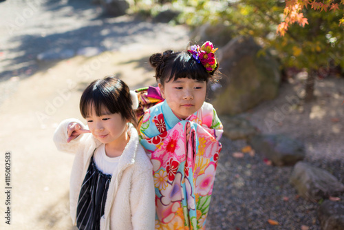 七五三のお参りに家族で神社に来た女の子 photo