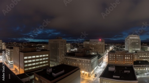 Wallpaper Mural A nighttime cityscape showcasing buildings and streets under a cloudy sky. Torontodigital.ca