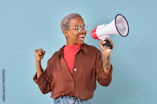 Enthusiastic individual joyfully raises a megaphone, showcasing confidence and energy. The backdrop is a lively blue, enhancing the positive vibes of this dynamic moment.
