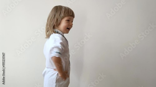 A little boy dressed in Ukrainian traditional clothes, vyshyvanka. Smiling child looking at the camera. Portrait of a little kid smiling child looking at the camera. Children's smile. Close-up face