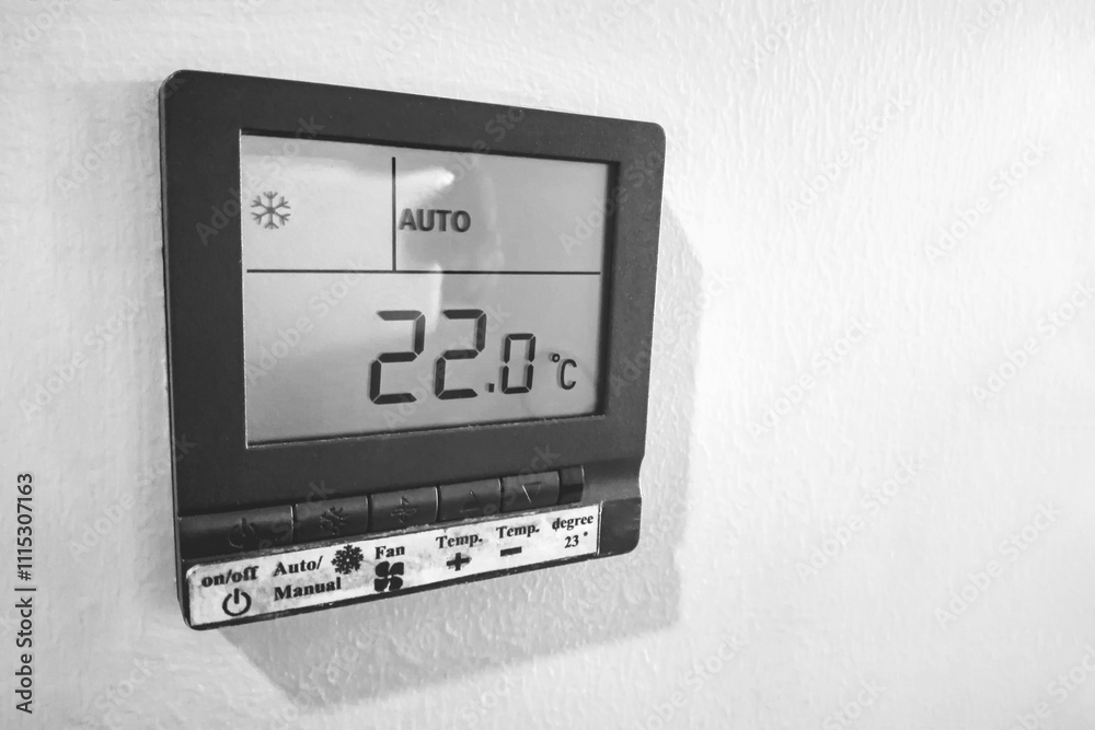 Comfortable cooling temperature in the room. Digital remote control of air conditioner on the wall. Electric consumption and energy saving. Comfortable cooling temperature in the room. Digital remote control of air conditioner on the wall. Electric consumption and energy saving.