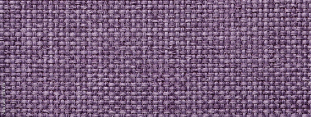 Fototapeta premium Texture violet background from woven textile material with wicker pattern, macro. Structure vintage purple fabric