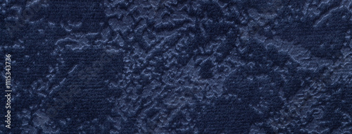 Texture velvet navy blue background from soft upholstery textile material, macro. Abstract velour denim fabric